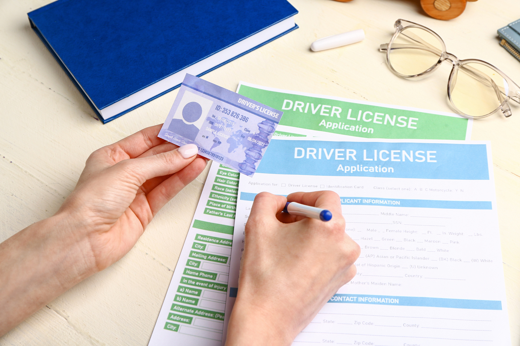 Woman Filling in Driver License Application at Table